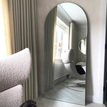 Large Frameless Arched Full Length Mirror reflecting natural light